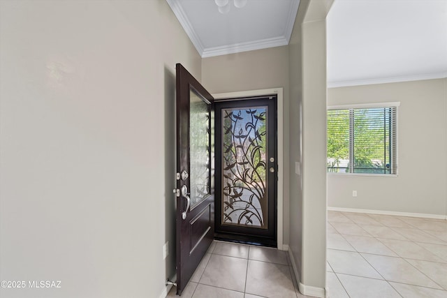 foyer featuring baseboards, light tile patterned flooring, and crown molding