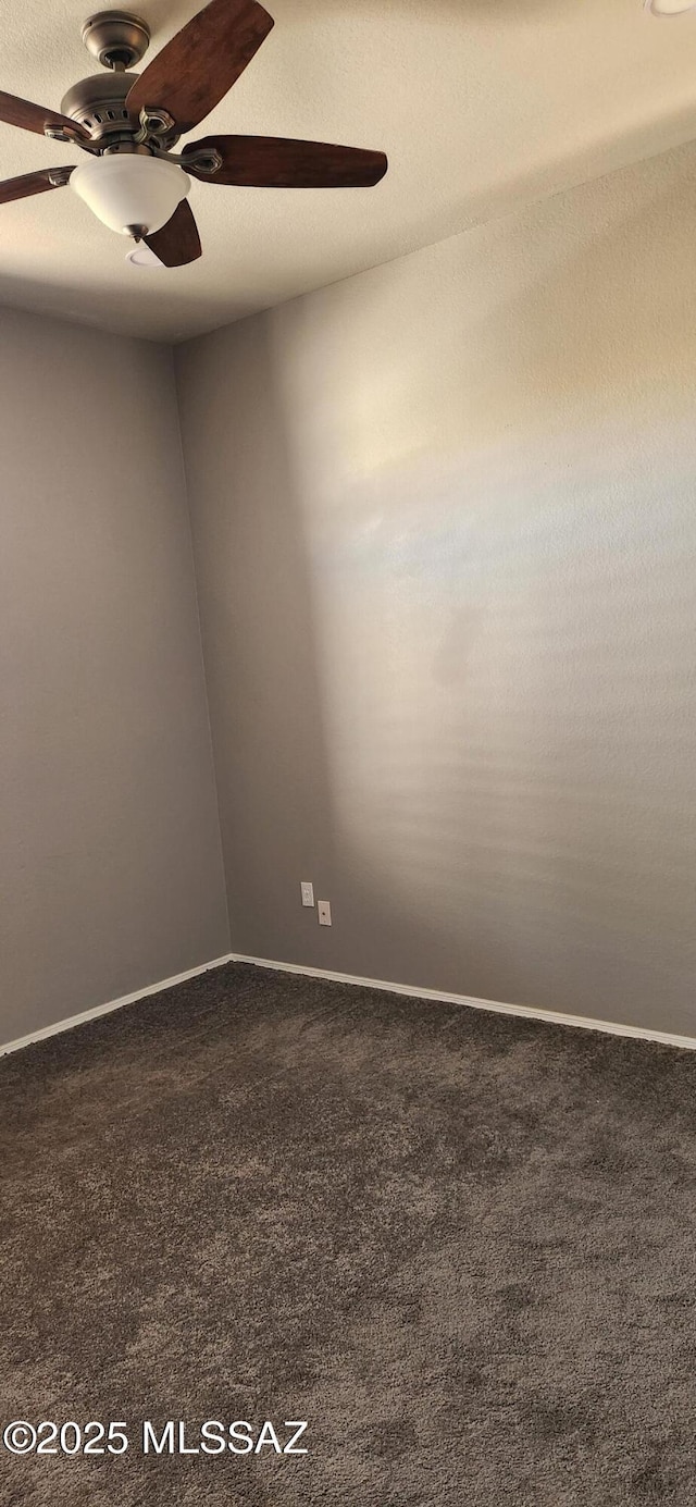 spare room with ceiling fan, a textured ceiling, carpet flooring, and baseboards