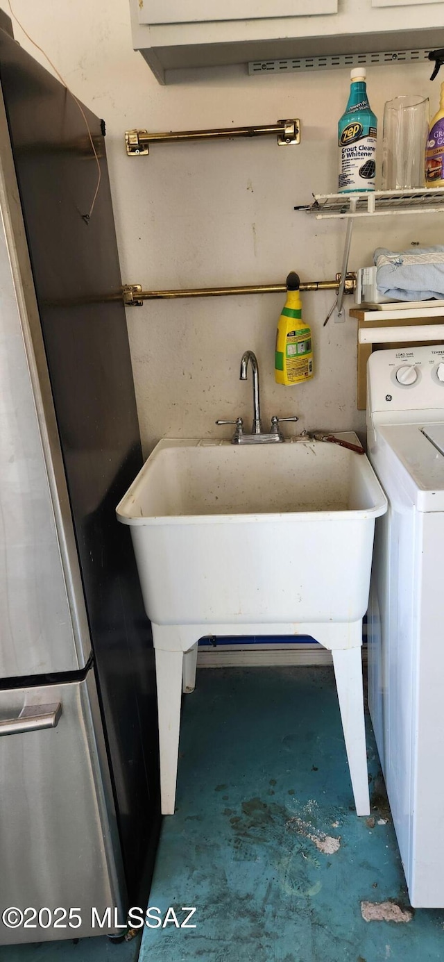 clothes washing area featuring laundry area and washer / clothes dryer