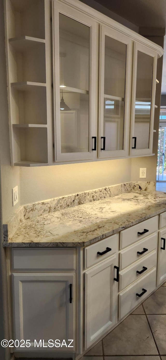 interior space with vanity and tile patterned floors