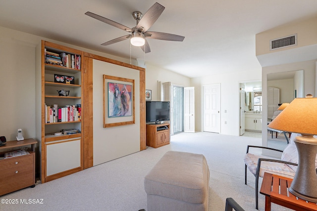 living room featuring a ceiling fan, visible vents, and carpet flooring