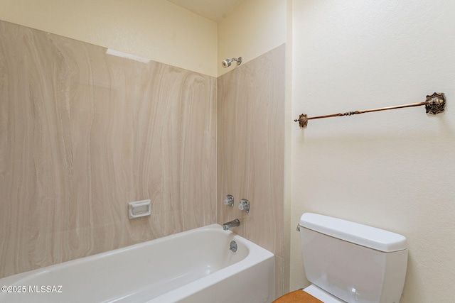 bathroom with toilet and shower / bathing tub combination