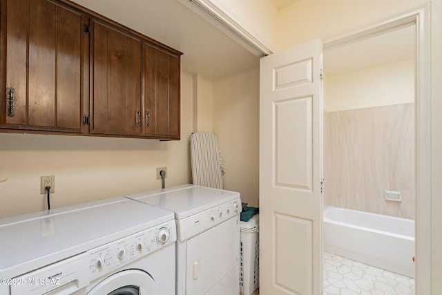 laundry room with cabinet space and washing machine and dryer