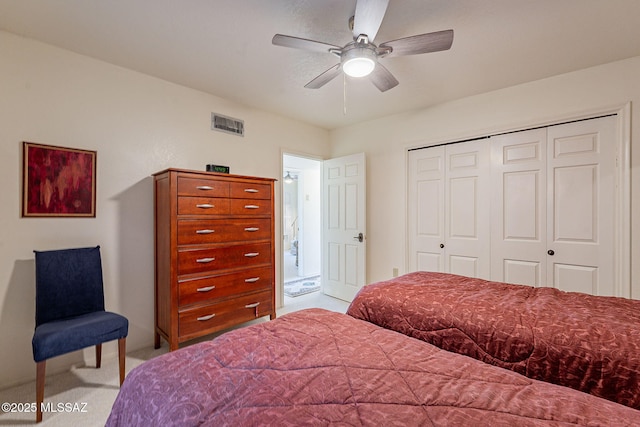 bedroom featuring a closet, carpet flooring, visible vents, and a ceiling fan