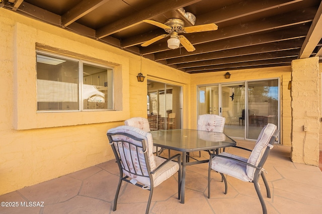 view of patio with outdoor dining area and ceiling fan