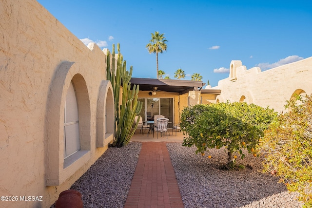 view of patio / terrace featuring ceiling fan