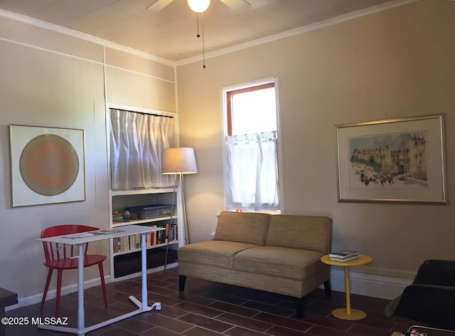 living room featuring crown molding, wood finished floors, baseboards, and ceiling fan