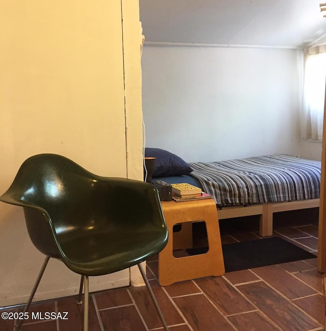 bedroom with wood tiled floor