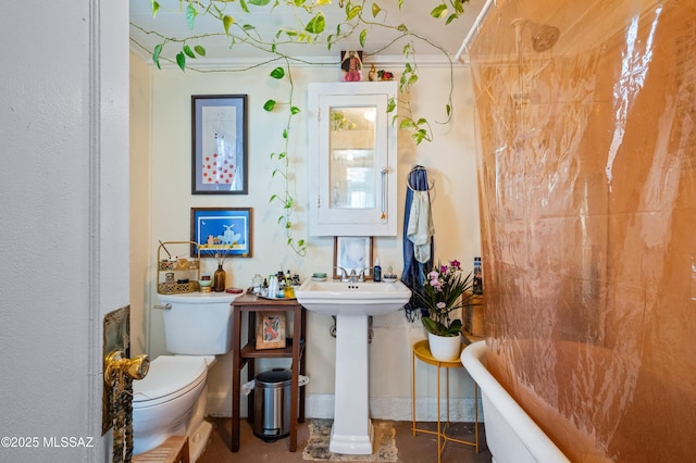 full bathroom with a bathtub, toilet, and a sink