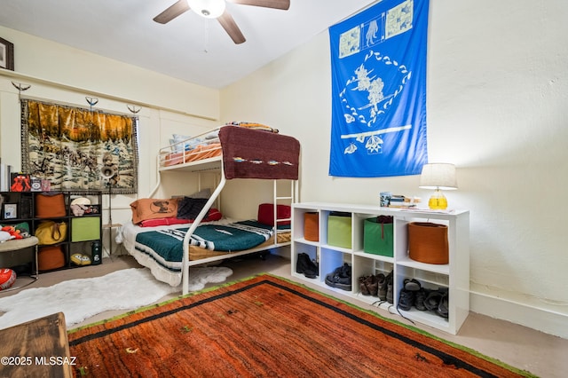 bedroom featuring concrete floors and ceiling fan