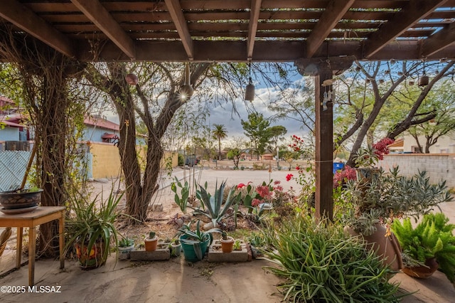 view of patio with fence and a pergola