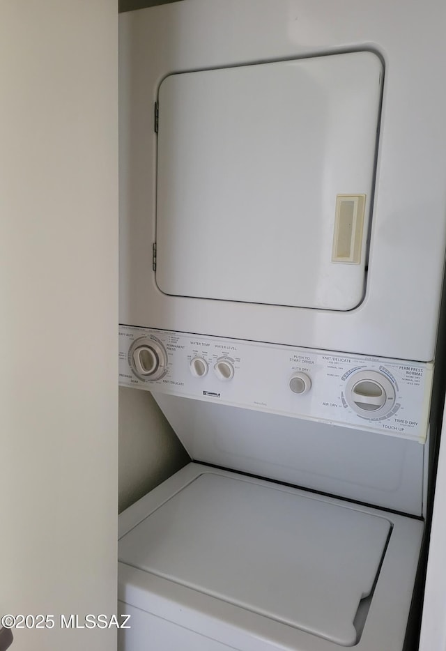 washroom with laundry area and stacked washer and dryer