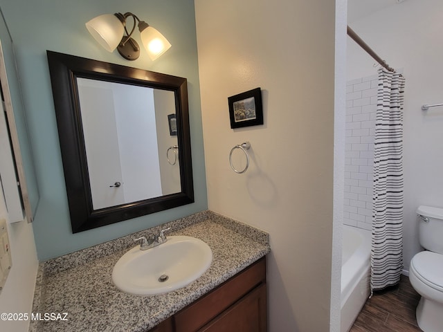 full bath featuring vanity, shower / tub combo, toilet, and wood finished floors