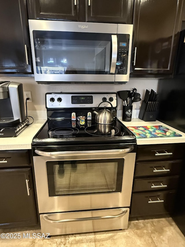 kitchen with stainless steel appliances and light countertops