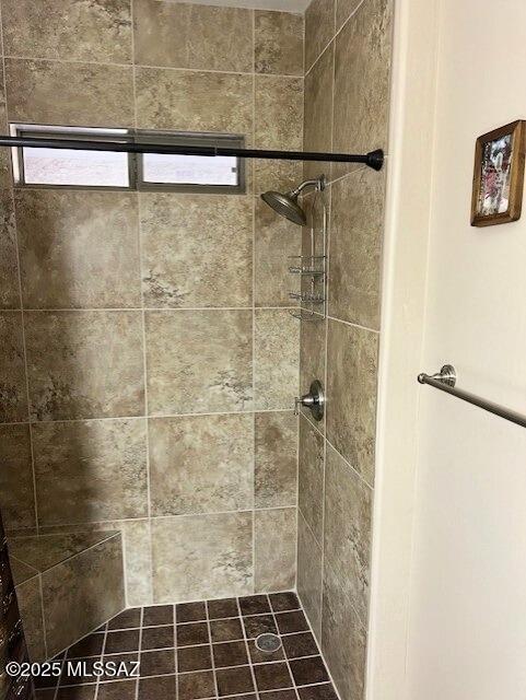 bathroom with a tile shower