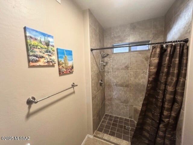 bathroom featuring tiled shower