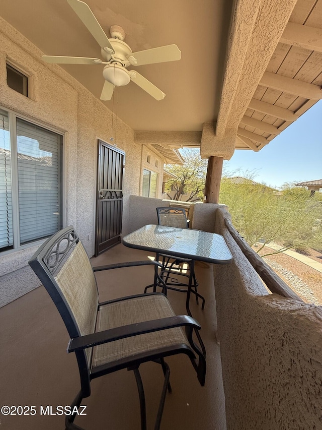 balcony featuring ceiling fan