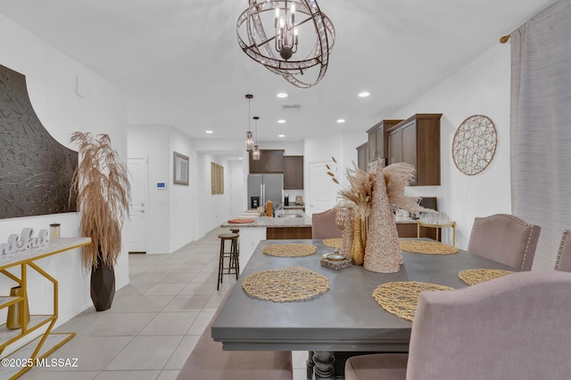 dining area featuring light tile patterned floors, a chandelier, recessed lighting, and visible vents