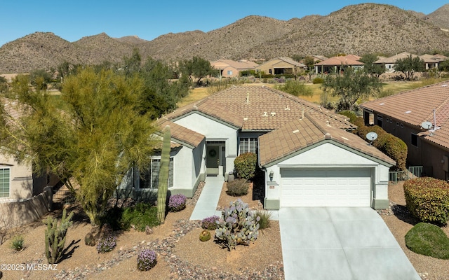 5084 W Desert Poppy Ln, Marana, AZ 85658 - ranch-style home featuring driveway, stucco siding, and a mountain view