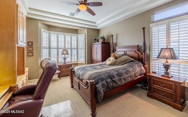 5084 W Desert Poppy Ln, Marana, AZ 85658 - bedroom featuring light carpet, visible vents, ceiling fan, and a tray ceiling