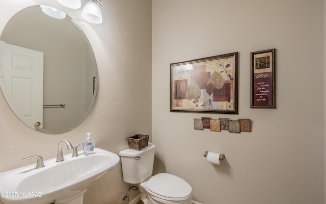5084 W Desert Poppy Ln, Marana, AZ 85658 - bathroom featuring toilet and a sink