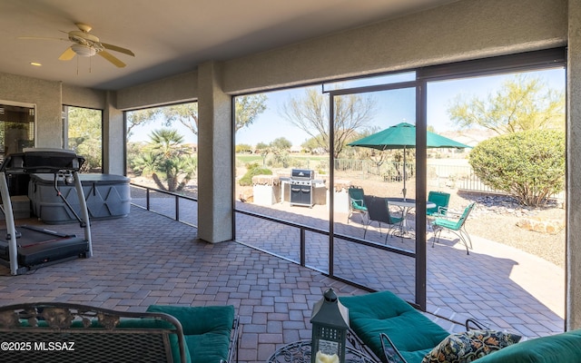 5084 W Desert Poppy Ln, Marana, AZ 85658 - sunroom / solarium featuring outdoor dining area, a hot tub, and ceiling fan