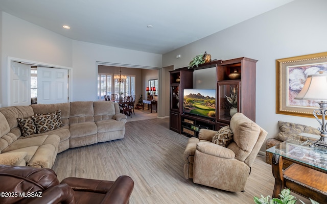 5084 W Desert Poppy Ln, Marana, AZ 85658 - living area with light wood-style floors, recessed lighting, and an inviting chandelier