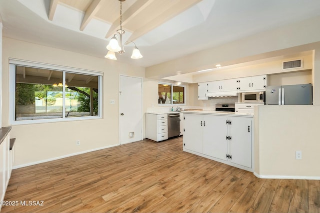 kitchen with decorative light fixtures, visible vents, appliances with stainless steel finishes, white cabinetry, and light wood-type flooring