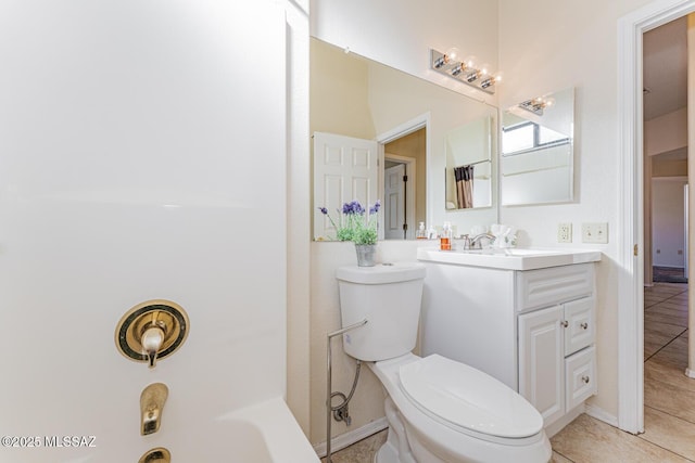 bathroom with toilet, tile patterned flooring, and vanity