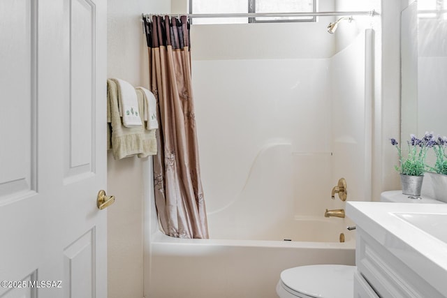 bathroom with vanity, toilet, and shower / bath combo with shower curtain