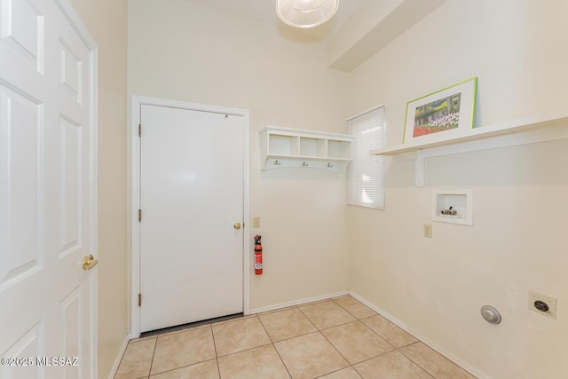 laundry area featuring laundry area, light tile patterned floors, baseboards, hookup for an electric dryer, and washer hookup