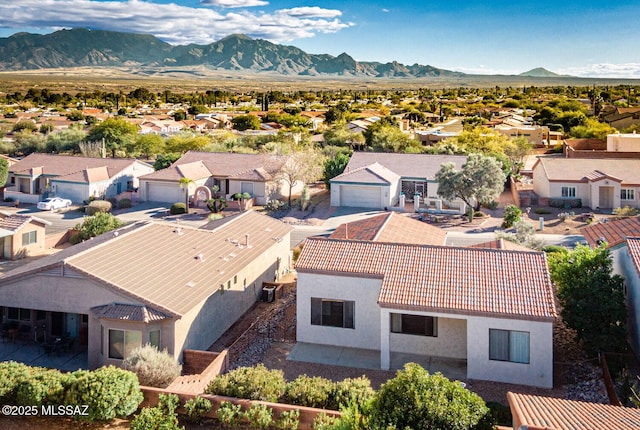 birds eye view of property with a residential view and a mountain view