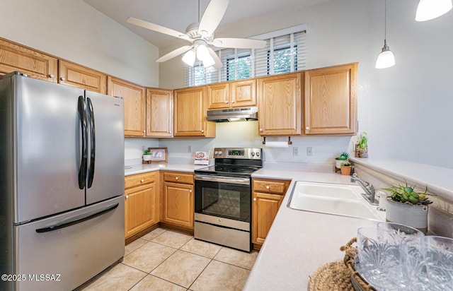 kitchen featuring light countertops, appliances with stainless steel finishes, light tile patterned flooring, a sink, and under cabinet range hood