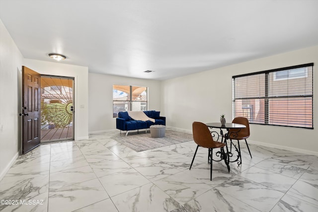 interior space with marble finish floor, visible vents, and baseboards