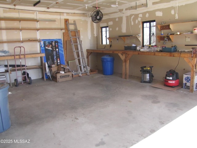 garage with a workshop area