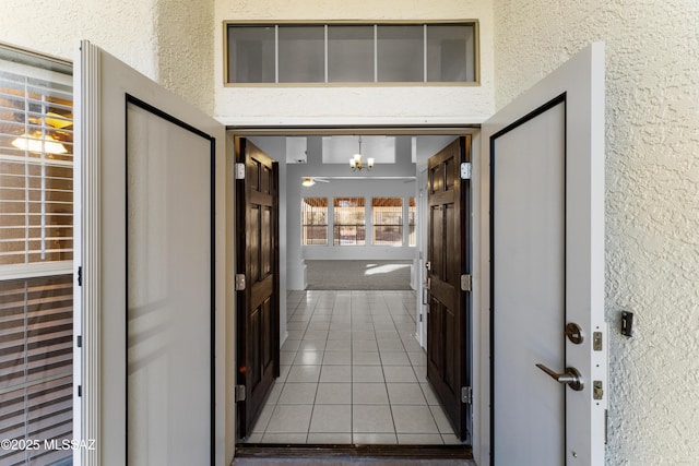 property entrance with stucco siding