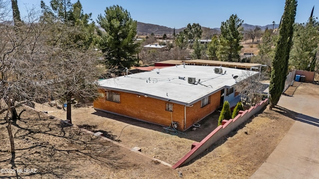 birds eye view of property with a mountain view