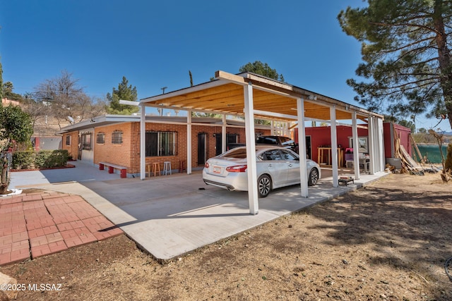 exterior space with a carport and driveway