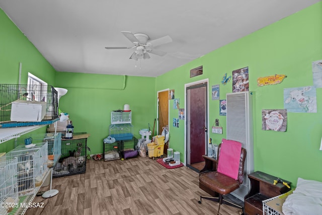 interior space featuring ceiling fan and wood finished floors