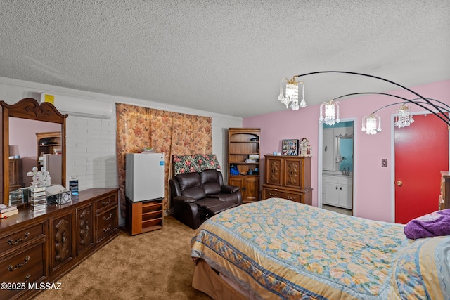 carpeted bedroom featuring a textured ceiling and a wall unit AC