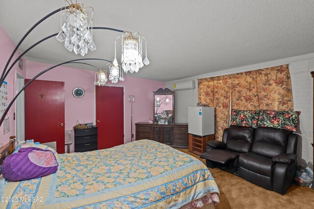 bedroom featuring carpet flooring, a textured ceiling, and a wall mounted AC