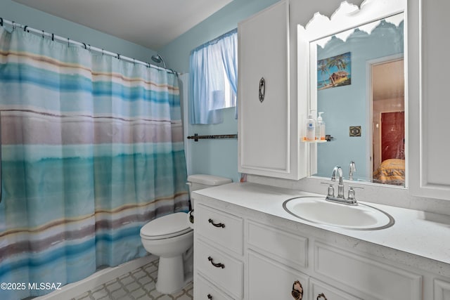 bathroom with tile patterned floors, toilet, vanity, and a shower with shower curtain