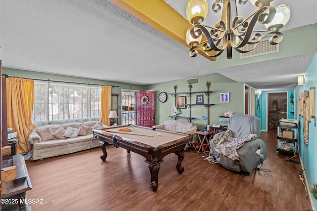 recreation room featuring visible vents, pool table, a textured ceiling, and wood finished floors