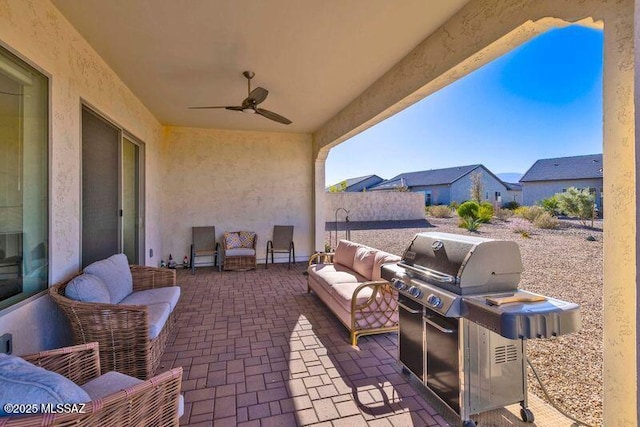 view of patio with an outdoor hangout area, area for grilling, and a ceiling fan