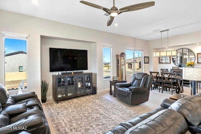 living area with plenty of natural light, recessed lighting, baseboards, and ceiling fan