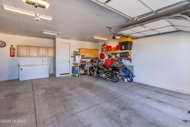 garage featuring baseboards and a garage door opener