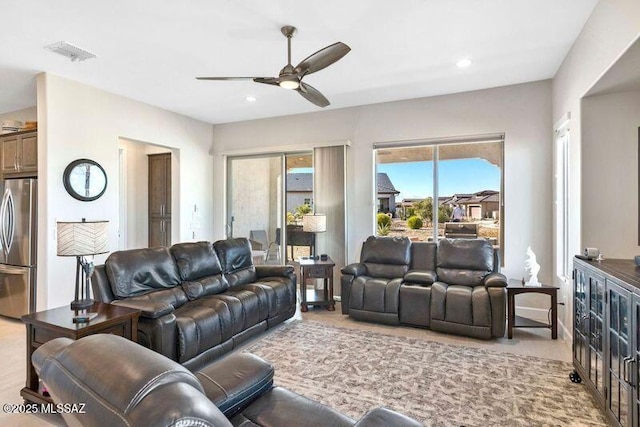 living room with recessed lighting, visible vents, and a ceiling fan