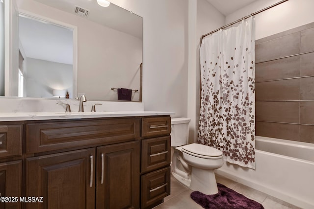 bathroom with vanity, tile patterned floors, toilet, and visible vents