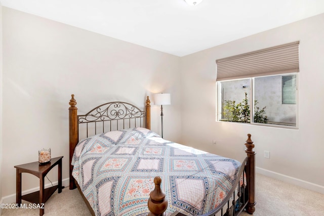 carpeted bedroom with baseboards