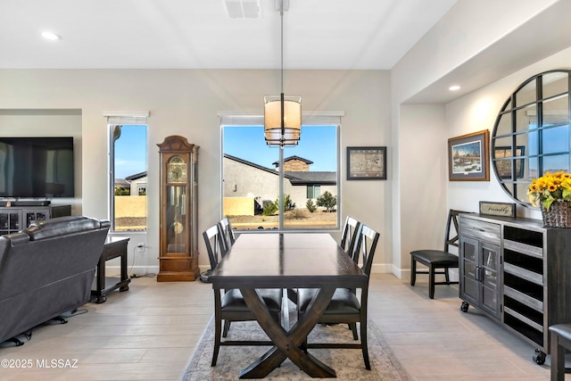 dining room featuring recessed lighting, visible vents, and light wood-style flooring